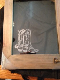 Etched boots on glass frame